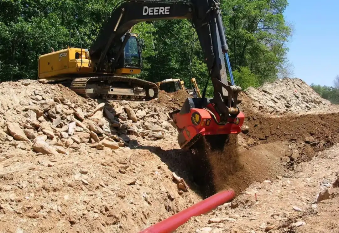 ALLU screening bucket returning screened material on a job site